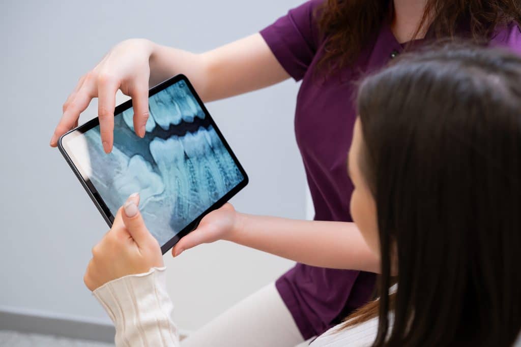 woman getting a comprehensive dental exam in Spring Valley, CA